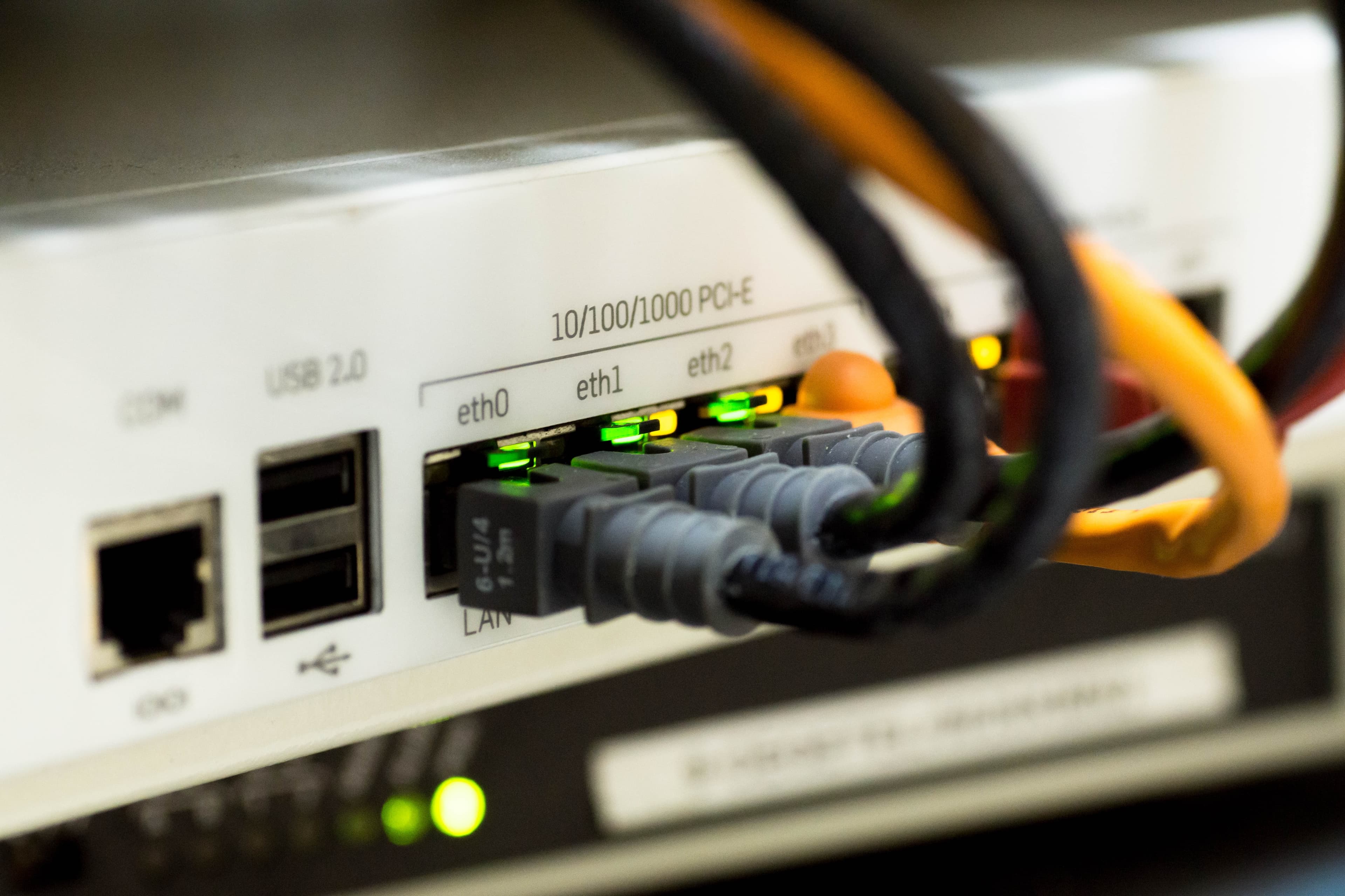router with network cables connected and green lights